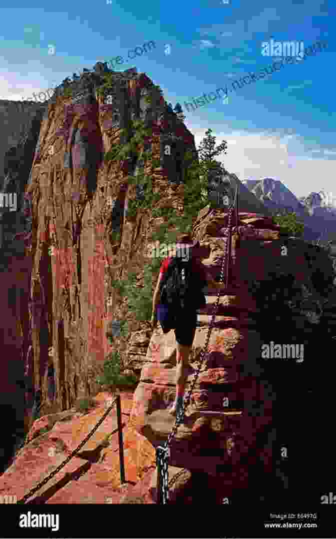 A Hiker Stands Atop Angels Landing, A Narrow Rock Fin With Sheer Drops On Both Sides, In Zion National Park, Utah. America S Best Day Hikes: Spectacular Single Day Hikes Across The States